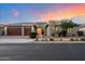 Beautiful single-story home with a three-car garage and manicured landscaping at 22842 E Via Las Brisas --, Queen Creek, AZ 85142