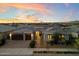 Beautiful single-story home featuring desert landscaping, a three-car garage and a welcoming entrance at 22842 E Via Las Brisas --, Queen Creek, AZ 85142
