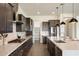 Gourmet kitchen featuring stainless steel appliances, quartz countertops, and ample cabinet space at 22842 E Via Las Brisas --, Queen Creek, AZ 85142