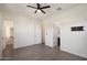 Main bedroom with wood-look tile and en suite bathroom access at 22842 E Via Las Brisas --, Queen Creek, AZ 85142