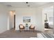 Spacious bedroom features plush carpet, neutral paint and a cozy sitting area near the entrance to the bathroom at 22842 E Via Las Brisas --, Queen Creek, AZ 85142
