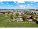 Aerial shot of a park featuring a gazebo, picnic tables, and lush green space, surrounded by homes in the neighborhood at 22842 E Via Las Brisas --, Queen Creek, AZ 85142