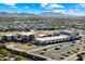 Aerial view of the community school, showing playground, parking area, and nearby homes against a mountain backdrop at 22842 E Via Las Brisas --, Queen Creek, AZ 85142