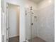 Modern shower featuring clear glass and neutral-toned marble tile at 22842 E Via Las Brisas --, Queen Creek, AZ 85142