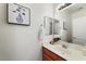 This bathroom features a large mirror, nice vanity, a sink, and art to enhance the space at 2402 E 5Th St # 1741, Tempe, AZ 85288
