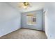 The clean bedroom offers carpet, a ceiling fan, window, and a closet for ample storage at 2402 E 5Th St # 1741, Tempe, AZ 85288