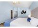 Calming bedroom features soft blue walls, plush carpeting, and minimalist decor at 2402 E 5Th St # 1741, Tempe, AZ 85288