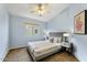 Comfortable bedroom with a ceiling fan, plush carpet, a window with blinds, and bedside tables at 2402 E 5Th St # 1741, Tempe, AZ 85288