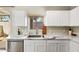 Bright kitchen showcasing marble countertops, stainless steel sink, and ample natural light from the window at 2402 E 5Th St # 1741, Tempe, AZ 85288