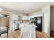 Modern kitchen with an island, bar stool seating, stainless steel appliances and granite countertops at 2402 E 5Th St # 1741, Tempe, AZ 85288