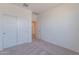 Bedroom with carpet, neutral walls, and a sliding door closet at 24184 W Gibson Ln, Buckeye, AZ 85326