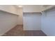 Walk-in closet with shelves and rods for storage at 24184 W Gibson Ln, Buckeye, AZ 85326