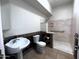 Accessible bathroom with neutral marble shower and pedestal sink at 2427 W Desert Hills Estate Dr, Phoenix, AZ 85086