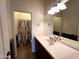 Bathroom showcasing a large vanity, mirror, and walk-in shower area with unique patterned curtain at 2427 W Desert Hills Estate Dr, Phoenix, AZ 85086