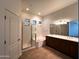 Bright bathroom with shower, tub, double sink vanity, and stained glass windows at 2427 W Desert Hills Estate Dr, Phoenix, AZ 85086