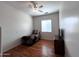 Cozy bedroom with hardwood floors, ceiling fan, and bright natural light at 2427 W Desert Hills Estate Dr, Phoenix, AZ 85086