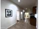 Hallway with tile floors, white walls, and access to multiple rooms at 2427 W Desert Hills Estate Dr, Phoenix, AZ 85086