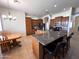 Bright kitchen with granite countertops, stainless steel appliances, and tile flooring at 2427 W Desert Hills Estate Dr, Phoenix, AZ 85086
