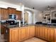 Spacious kitchen with granite counters, stainless steel appliances and tile backsplash at 2427 W Desert Hills Estate Dr, Phoenix, AZ 85086
