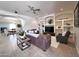 Well-decorated living room showcasing an open floor plan with dining area and built-in shelves at 2427 W Desert Hills Estate Dr, Phoenix, AZ 85086