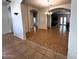 Bright living room featuring tile flooring and arched doorways leading to other rooms at 2427 W Desert Hills Estate Dr, Phoenix, AZ 85086