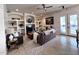 Inviting living room with stylish decor, built-in shelving, and a cozy atmosphere at 2427 W Desert Hills Estate Dr, Phoenix, AZ 85086