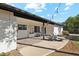 Great backyard patio area with Adirondack chairs, outdoor furniture, and a lush green lawn at 2435 E Jensen St, Mesa, AZ 85213