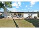 Spacious backyard with a patio, furniture, well-manicured lawn, and plenty of privacy at 2435 E Jensen St, Mesa, AZ 85213