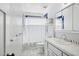 Bathroom with a shower/tub combo, white tile, and traditional style vanity at 2435 E Jensen St, Mesa, AZ 85213