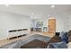 Bright living room featuring hardwood floors, fresh paint, and a rustic wooden front door at 2435 E Jensen St, Mesa, AZ 85213