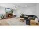 Cozy living room with fireplace, hardwood floors, and comfortable seating; great for relaxing or entertaining at 2435 E Jensen St, Mesa, AZ 85213
