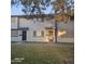 Charming townhome featuring a well-maintained front lawn, secured entrance, and neutral tones at 2537 W Rose Ln # A6, Phoenix, AZ 85017