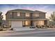 Two-story home featuring a spacious two-car garage and desert landscaping at 26023 S 224Th Pl, Queen Creek, AZ 85142