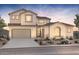 Charming two-story stucco home with a two-car garage and desert landscaping, showcasing Southwest architecture at 26026 S 224Th Way, Queen Creek, AZ 85142