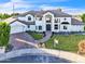 Aerial view of a two-story white brick home with a circular driveway and mature landscaping at 2662 N Chestnut Cir, Mesa, AZ 85213