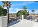 Covered balcony offers views of lush landscaping and distant mountains, perfect for relaxing at 2662 N Chestnut Cir, Mesa, AZ 85213