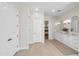 Spacious bathroom with double vanity, decorative lighting, and ample storage space at 2662 N Chestnut Cir, Mesa, AZ 85213