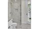 Modern bathroom showcasing a glass-enclosed shower with marble tile and access to a door to the outside at 2662 N Chestnut Cir, Mesa, AZ 85213