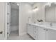 Elegant bathroom featuring double sink vanity with marble countertop, modern fixtures, and marble floors at 2662 N Chestnut Cir, Mesa, AZ 85213