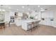 Spacious, well-lit kitchen with stainless steel appliances, dual islands, wood floors, and pendant lighting at 2662 N Chestnut Cir, Mesa, AZ 85213