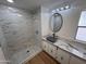 Bathroom features marble-look shower and countertop and an updated sink and mirror at 303 S Recker Rd # 50, Mesa, AZ 85206