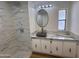 Bathroom features marble-look shower and countertop and an updated sink and mirror at 303 S Recker Rd # 50, Mesa, AZ 85206