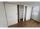A walk-in closet with plenty of shelving and sliding doors provides ample storage space for clothing and accessories at 303 S Recker Rd # 50, Mesa, AZ 85206