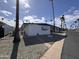 Quaint mobile home exterior with covered parking and drought-tolerant landscaping at 303 S Recker Rd # 50, Mesa, AZ 85206