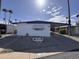 Charming mobile home with covered parking, rock landscaping, and palm tree views at 303 S Recker Rd # 50, Mesa, AZ 85206