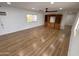 Bright living room with wood floors, ceiling fan, and built-in cabinet space at 303 S Recker Rd # 50, Mesa, AZ 85206