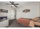 A bedroom with carpet, fan, and bed. The room features Star Wars themed decor at 3047 W Sandra Ter, Phoenix, AZ 85053