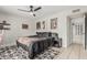 The primary bedroom features neutral walls, a ceiling fan, and a window for natural light at 3047 W Sandra Ter, Phoenix, AZ 85053