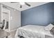 Bedroom with a blue accent wall, ceiling fan, and carpeted floors at 3047 W Sandra Ter, Phoenix, AZ 85053