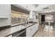 The kitchen features a stainless steel double sink with white cabinets and a view of the backyard at 3047 W Sandra Ter, Phoenix, AZ 85053